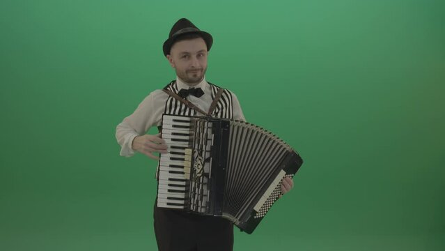 Virtuoso player man with Accordion isolated on green screen in front view
