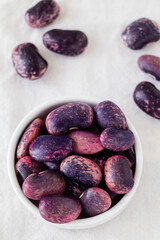 Bowl with fersh purple pink scarlet runner beans.