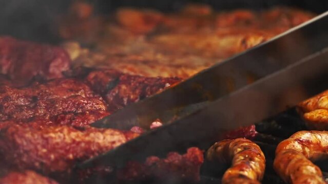 sausages and romanian traditional food Meat Balls 'mici' on grill. Slow motion