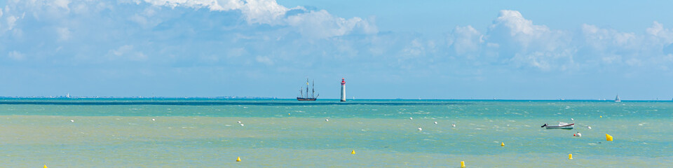 Phare de Chauveau lighthouse and the Shtandart, a russian frigate ship sailing  in the Atlantic...