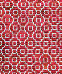 Abstact knitted background. Crochet mosaic pattern. Seamless overlay red white crochet texture.
