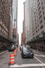 Fifth Avenue or 5th Avenue New York with cars, people and its various buildings. 2023.