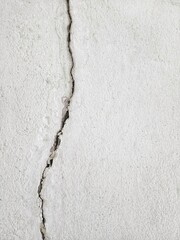 Vertical cracked concrete wall background.