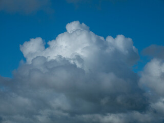White fluffy clouds in the stormy sky background