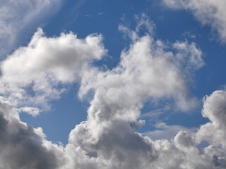 Fototapeta na wymiar White fluffy clouds over blue sky background, beautiful heaven photo