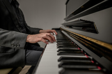 Pianist musician hands playing classical piano music instrument learning practicing jazz harmony...