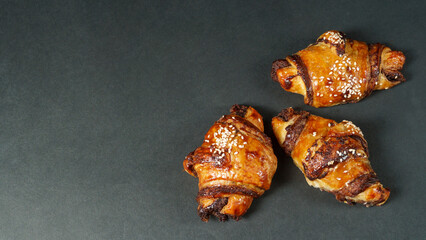 Croissant chocolate close up on black background