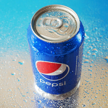 Kiev, Ukraine - May 12 2023: Pepsi Cola softdrink can on blue background, cold Pepsi Pepsi is carbonated soft drink produced by PepsiCo. Pepsi was created and developed in 1893