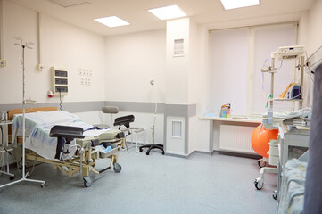 Interior empty hospital ward in modern maternity clinic. Childbirth. Delivery. Labor concept. Obstetrics and gynecology.