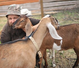 
Farmer
hugging a beautiful Nubian goat