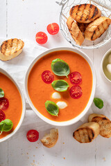 Creamy tomato soup with mozzarella cheese and crostini.