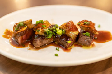Tournedos Rossini recipe with foie gras on top of the steak. 