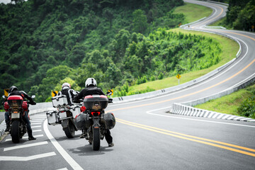 motorcycle on the road rides away. Travel on vacation, enjoy the nature trail. motorcycle in a sunny motorbike on the road riding.with sunset light. copyspace for your individual text.	