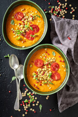 Delicious lentil soup with cream and cherry tomatoes.