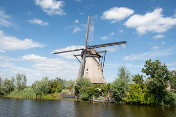 iconic smock ground sailer windmill in Kinderdijk Netherlands. Landmark buildings originally made to pump water out of low land polder to preserve land reclaimed from the sea