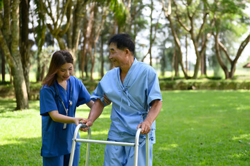 Asian Female Doctor Help Support Senior Patient and Provide Encouragement During Treatment. Rehabilitation or Physical Therapy of Asian Retired Patients with Walking Aids.