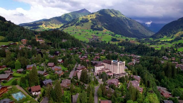 Gstaad - elegant and popular mountain ski resort in Swizerland, canton Bern. aerial drone video
