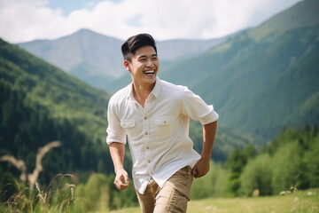 Obraz premium Happiness Asian Man In Beige Jeans On Mountain Scenery Background
