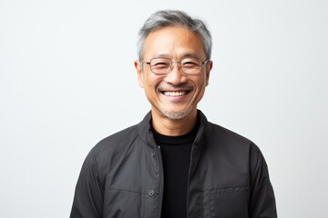 Obraz premium Portrait of happy asian senior man in black jacket and glasses