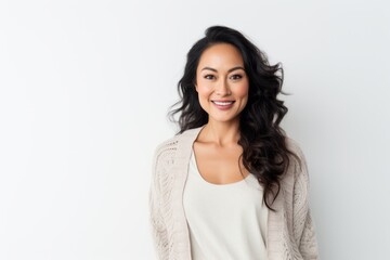 Fototapeta premium Portrait of a beautiful young woman smiling at the camera on a white background