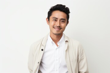 Portrait of a happy young asian man on white background.