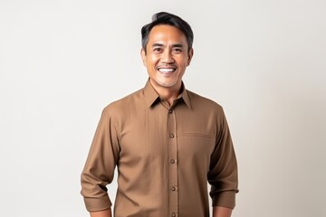 Obraz premium Portrait of a happy smiling asian man standing on white background