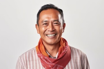 Portrait of a smiling asian man with a scarf on white background - obrazy, fototapety, plakaty