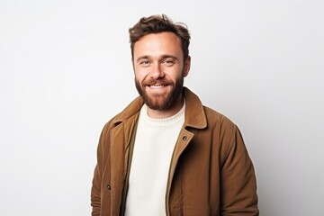 Obraz premium Medium shot portrait of a Russian man in his 30s in a white background wearing a chic cardigan