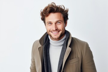 Fototapeta premium Medium shot portrait of a Russian man in his 30s in a white background wearing a chic cardigan