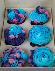 Cupcakes in a Box with Blue Frosting and Purple Ribbon (2).jpg