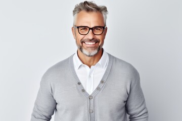Portrait of handsome mature man in eyeglasses smiling at camera