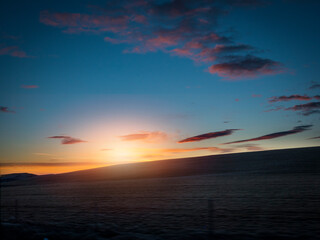 Fototapeta na wymiar Photo of a beautiful sunset over a serene Icelandic body of water
