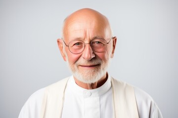 Fototapeta premium Portrait of a smiling senior man with eyeglasses isolated on a white background