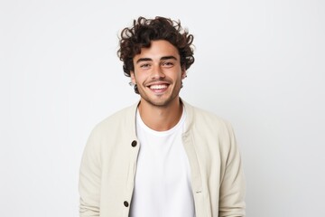 Medium shot portrait of a Brazilian man in his 20s in a white background wearing a chic cardigan