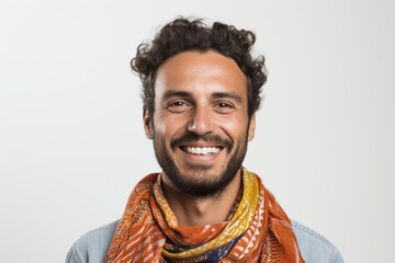 Obraz premium Portrait of a smiling young man with a scarf over white background