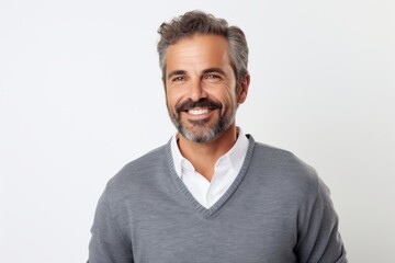 Obraz premium Lifestyle portrait of a Brazilian man in his 40s in a white background wearing a chic cardigan