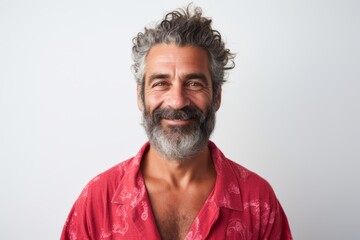 Obraz premium Medium shot portrait of a Brazilian man in his 50s in a white background wearing a snuggly pajama set