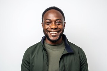 Medium shot portrait of a Nigerian man in his 30s in a white background wearing a chic cardigan