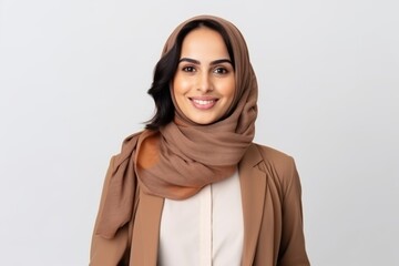Portrait of happy young muslim woman in hijab looking at camera