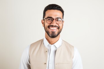 Portrait of a happy young man with eyeglasses on white background