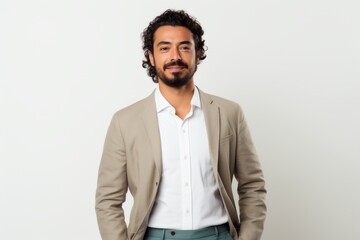 Fototapeta premium Portrait of a handsome young Indian man with curly hair and beard