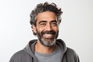 Fototapeta premium Portrait of a handsome bearded man smiling and looking at camera isolated on a white background