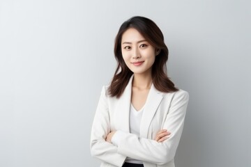 Portrait of asian business woman in white suit on white background