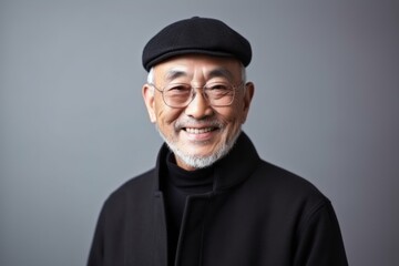 Obraz premium Portrait of a senior asian man in black turtleneck and cap