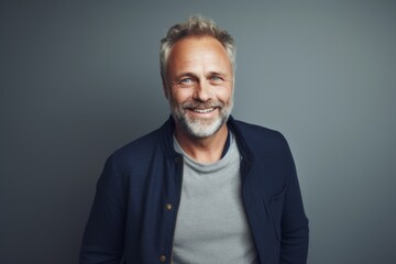 Obraz premium Portrait of a handsome middle-aged man smiling at the camera.