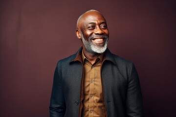 Obraz premium Portrait of a happy mature african american man smiling at camera