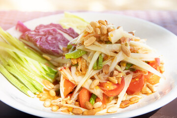 Papaya salad : spicy salad serve with vegetables, popular thai food (Som Tum).