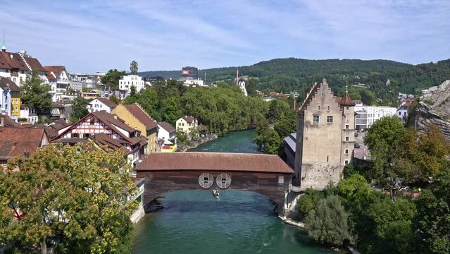 Scenic view of Limmat River at Swiss City of Basen on a sunny summer day. Movie shot August 19th, 2023, Baden, Switzerland.