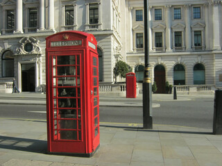 Red telephone boxes on a London street