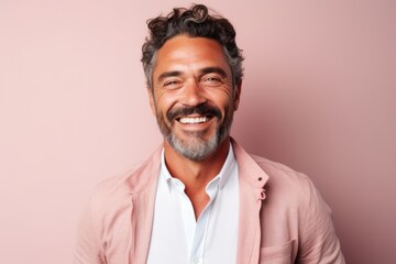 Obraz premium Medium shot portrait of a Brazilian man in his 40s in a pastel or soft colors background wearing a chic cardigan